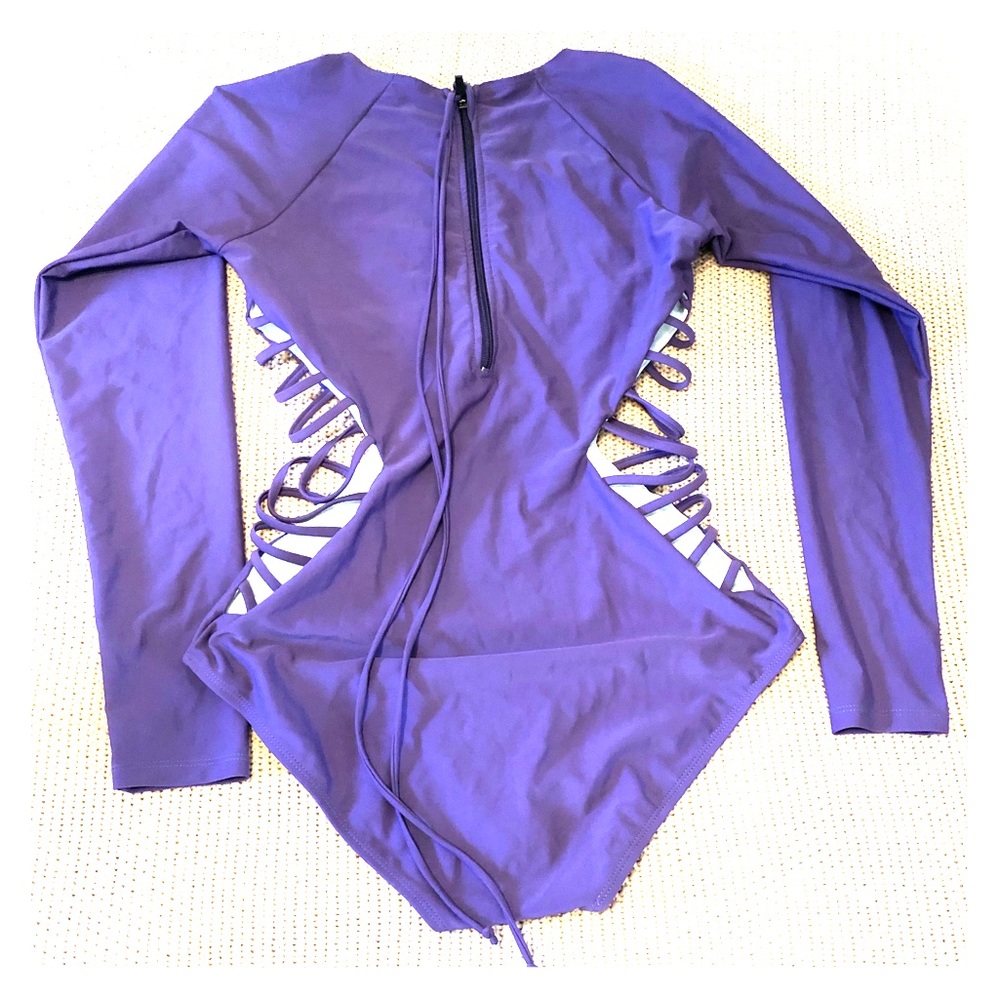 Purple rash guard one piece with side cut outs